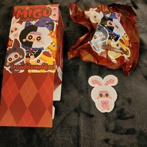 Migo Troublemaker Collectible Figure bag is sealed box opened from bottom